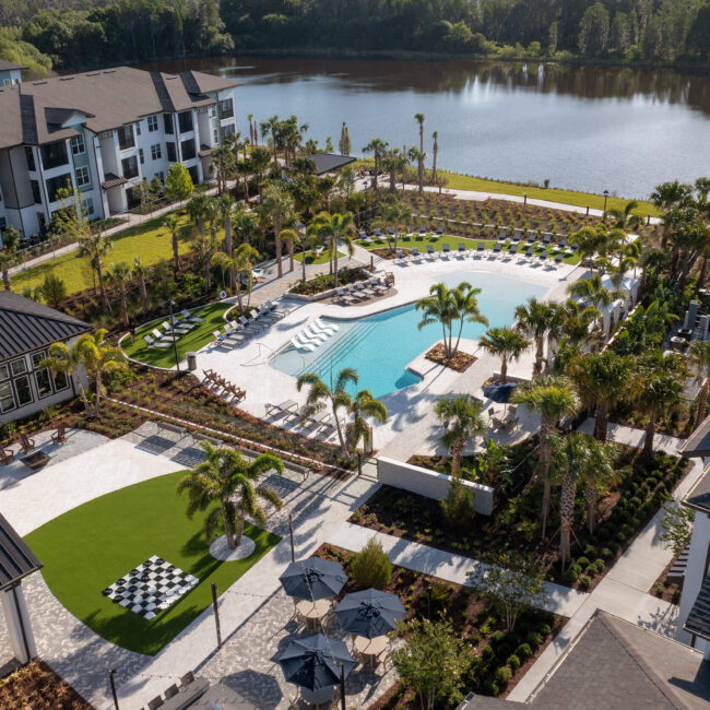 Bainbridge Sunlake aerial of pool area near body of water in between the multistory buildings