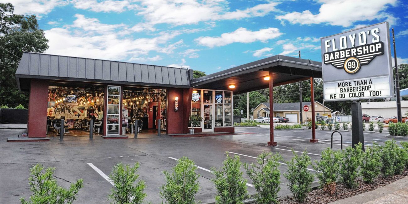 Floyd's Barbershop exterior with garage doors open