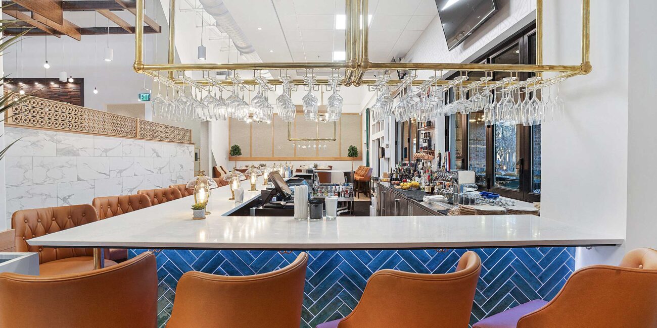 Harvest Restaurant bar area with angled terra cotta-colored bar stools