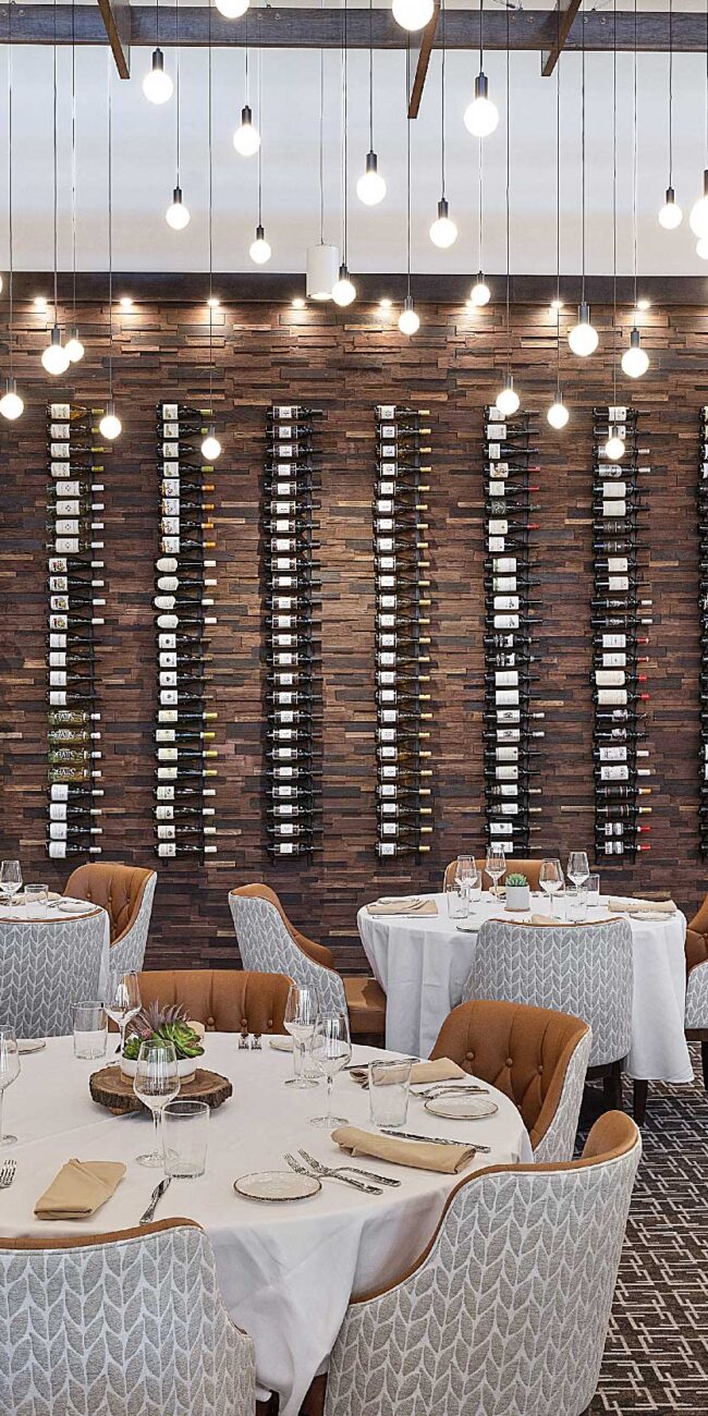 Harvest Restaurant wine bottle wall from dining area